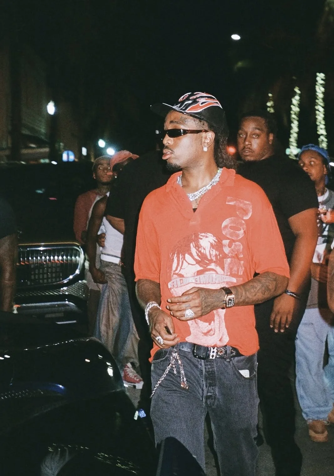 Quavo wearing the Red QRÖME Polo at night